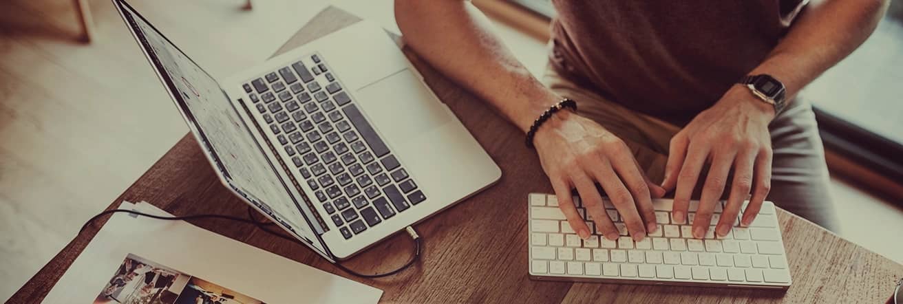 Person typing at a desk